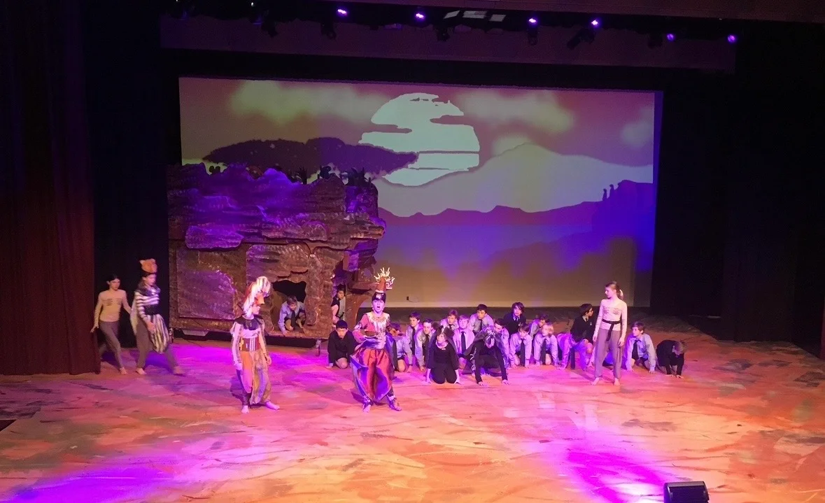 Students in costume during school production performance